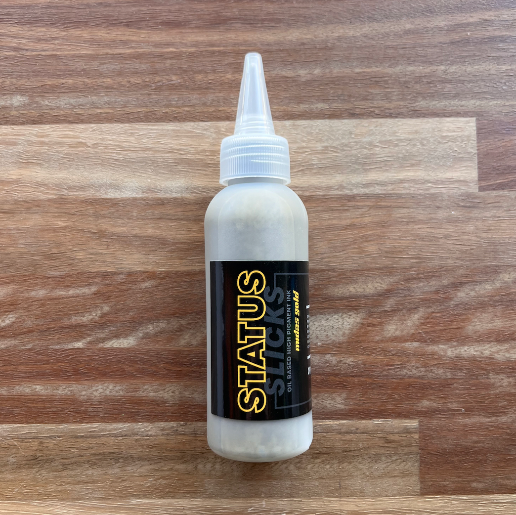 Status - Slicks Ink