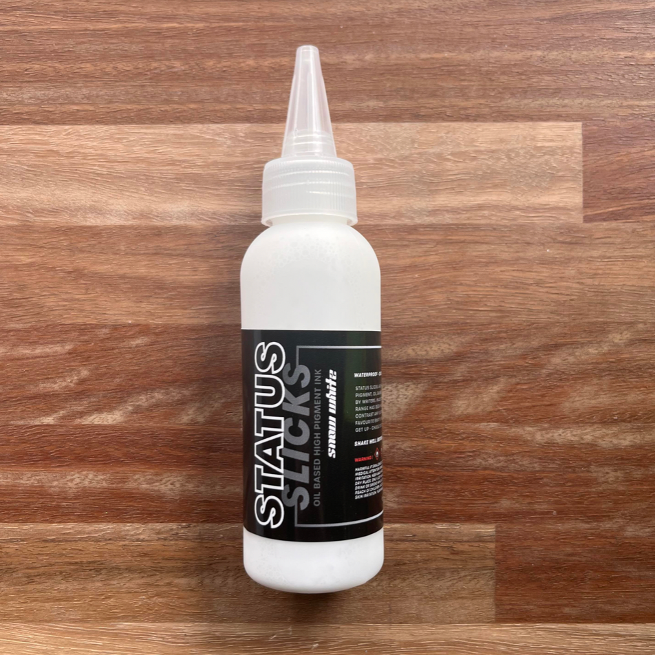 Status - Slicks Ink